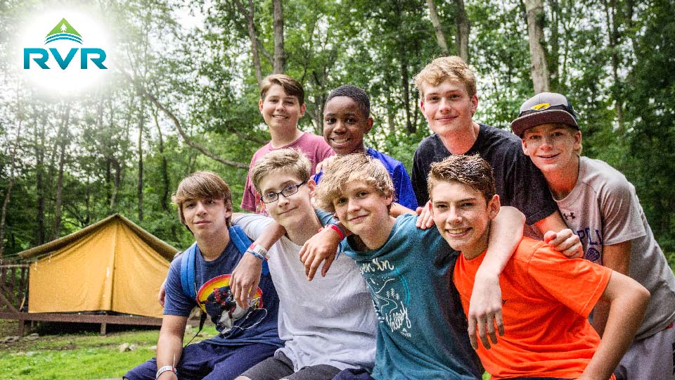 boys outside summer camp tent